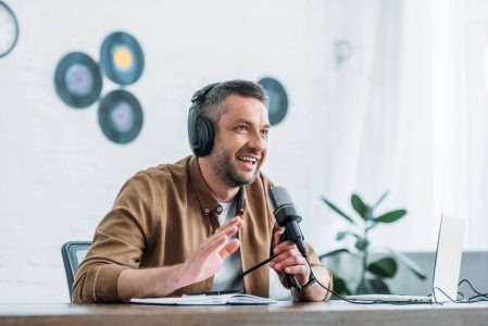 cheerful-radio-host-gesturing-while-recording-podc-2021-09-03-07-42-01-utc.jpg
